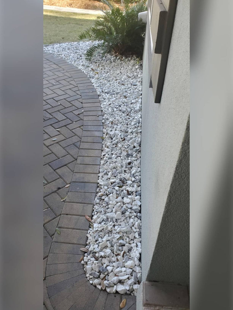 Amazon review praising Shabebe Rock Glue for strong rock bonding that prevents scattering during leaf blowing.